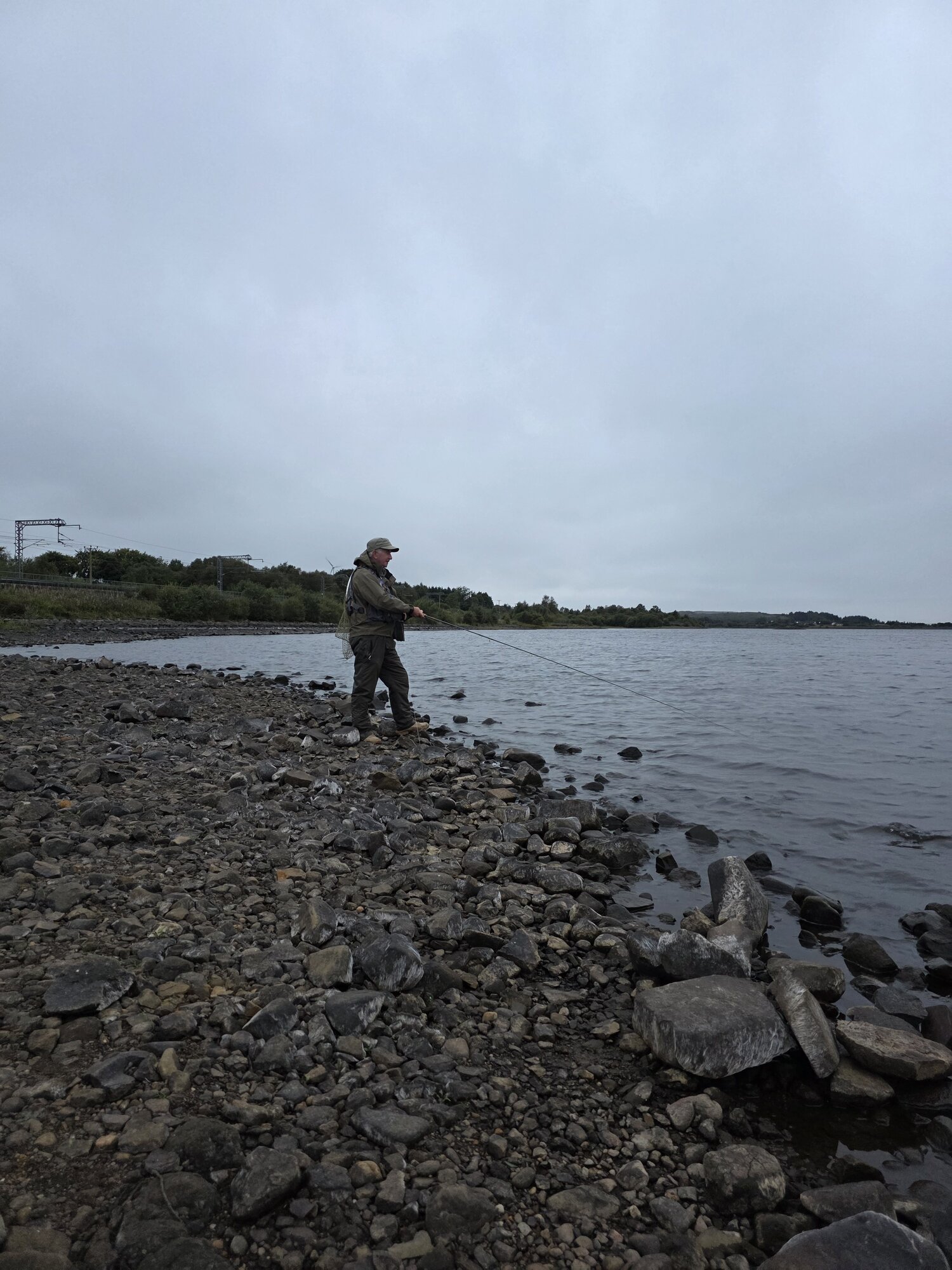 Anglers with trout at Hillend Loch